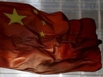FILE PHOTO: China's national flag flutters at a business district in Beijing, October 29, 2015.  REUTERS/Kim Kyung-Hoon/File Photo