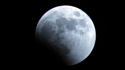 The Earth's shadow starts to cover the Moon during Lunar Eclipse in Tokyo. (AP) The Earth's shadow starts to cover the Moon during Lunar Eclipse in Tokyo. (AP)
