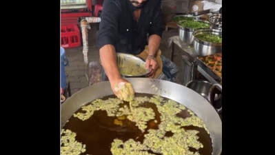 Snapshot of the pakoda seller dipping his hand in hot oil. Snapshot of the pakoda seller dipping his hand in hot oil.