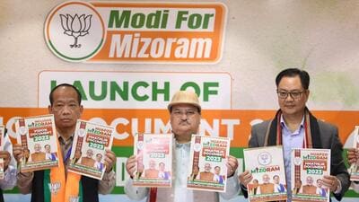 BJP national president JP Nadda with party's Mizoram president Vanlalhmuaka and Union minister and party leader Kiren Rijiju during the release of party's manifesto for Mizoram assembly election, in Aizawl (PTI)