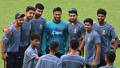 Bangladesh's captain Shakib Al Hasan (C) poses for a photograph with local net bowlers during a practice session on the eve of their 2023 ICC Men's Cricket World Cup one-day international (ODI) match against Netherlands (AFP) Bangladesh's captain Shakib Al Hasan (C) poses for a photograph with local net bowlers during a practice session on the eve of their 2023 ICC Men's Cricket World Cup one-day international (ODI) match against Netherlands (AFP)
