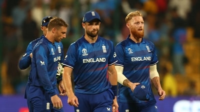 England's Chris Woakes, Jos Buttler and Ben Stokes look dejected after the match against Sri Lanka (REUTERS)
