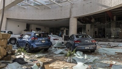 Damaged cars in front of a hotel in the aftermath of Hurricane Otis in Acapulco, Guerrero state, Mexico. (Bloomberg) Damaged cars in front of a hotel in the aftermath of Hurricane Otis in Acapulco, Guerrero state, Mexico. (Bloomberg)