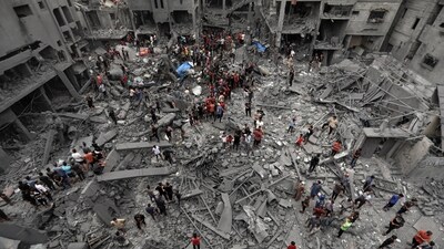 Palestinians inspect the damage of destroyed buildings following Israeli airstrikes on Gaza City. (AP Photo) Palestinians inspect the damage of destroyed buildings following Israeli airstrikes on Gaza City. (AP Photo)