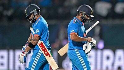 India's Virat Kohli arrives to bat as team's captain Rohit Sharma (R) walks back to the pavilion (AFP) India's Virat Kohli arrives to bat as team's captain Rohit Sharma (R) walks back to the pavilion (AFP)