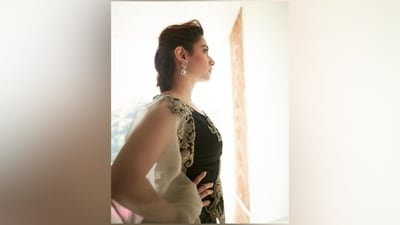 Tamannaah wore the dress with striking gold and pink stone-embellished earrings and a bracelet. She completed the look with high heels, muted pink eye shadow, mascara on the lashes, rouge on the cheeks, darkened brows, glossy blush pink lip shade, and a messy back-swept hairdo. (Instagram)