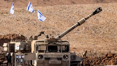 An Israeli army M109 155mm self-propelled howitzer is deployed at a position along the border with the Gaza Strip near Sderot in southern Israel on October 27, 2023 amid ongoing battles between Israel and the Palestinian Hamas movement. (AFP) An Israeli army M109 155mm self-propelled howitzer is deployed at a position along the border with the Gaza Strip near Sderot in southern Israel on October 27, 2023 amid ongoing battles between Israel and the Palestinian Hamas movement. (AFP)