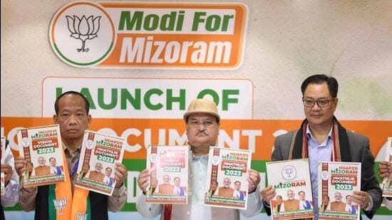 BJP national president JP Nadda with party's Mizoram president Vanlalhmuaka and Union minister and party leader Kiren Rijiju during the release of party's manifesto for Mizoram assembly election, in Aizawl (PTI)