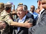 United Nations Secretary-General Antonio Guterres speaks outside the gate of the Egyptian side of the Rafah border crossing with the Gaza Strip on October 20.