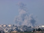 A picture taken from the southern Israeli city of Sderot shows smoke ascending over the northern Gaza Strip following an Israeli strike on October 25, 2023, amid the ongoing battles between Israel and the Palestinian group Hamas. (Photo by RONALDO SCHEMIDT / AFP)