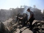 Palestinians inspect the rubble of destroyed buildings following Israeli airstrikes on town of Khan Younis, southern Gaza Strip on October 26. Palestinians inspect the rubble of destroyed buildings following Israeli airstrikes on town of Khan Younis, southern Gaza Strip on October 26.