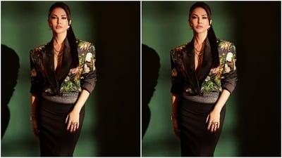 Her outfit consisted of a black satin blazer with elbow-length sleeves, power shoulder, deep v-neckline, double collar and an intriguing floral print all over. She paired it with a fish-cut black maxi skirt with a silver shimmering belt at the waist. (Instagram/@sunnyleone)