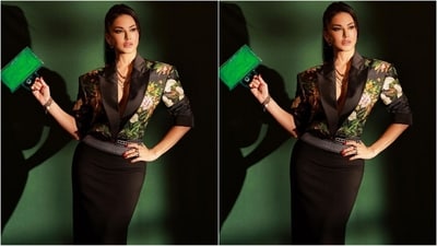 Sunny accessorised her look with a multi layered chain necklace, stacked bracelet, gold hoop earrings and multiple rings adorning her fingers. With a green mini handbag and a pair of back heels, Sunny completed her glam look. (Instagram/@sunnyleone)