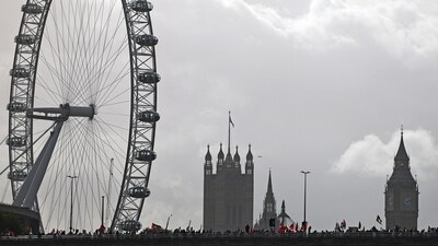 Israel-Hamas War: People wave Palestinian flags as they cross Waterloo Bridge during a 'March For Palestine' in London. (AFP) Israel-Hamas War: People wave Palestinian flags as they cross Waterloo Bridge during a 'March For Palestine' in London. (AFP)