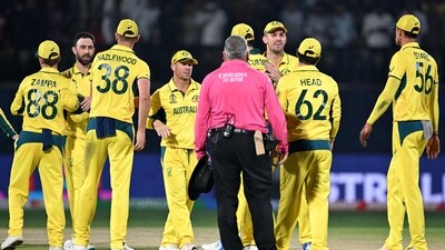 Australia's players greet each other after their victory in the 2023 ICC Men's Cricket World Cup one-day international (ODI) match between Australia and New Zealand (AFP)