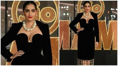 Sonam Kapoor appeared absolutely stunning in her ensemble, choosing to wear an elegant black velvet dress. She opted for a bold makeup look and secured her hair into a chic bun. To add a touch of sophistication to her appearance, Sonam adorned herself with a pearl necklace and complementing pearl earrings. Sonam Kapoor appeared absolutely stunning in her ensemble, choosing to wear an elegant black velvet dress. She opted for a bold makeup look and secured her hair into a chic bun. To add a touch of sophistication to her appearance, Sonam adorned herself with a pearl necklace and complementing pearl earrings.