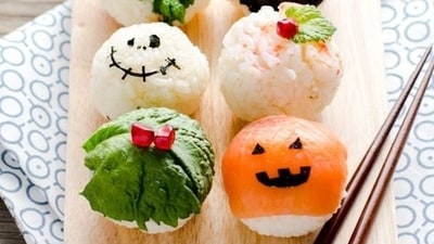 Halloween Sushi Balls: Prepare Halloween Sushi Balls by shaping seasoned sushi rice into small balls and decorating them with edible nori seaweed cutouts to create spooky or cute Halloween characters.&nbsp; (Pinterest)
