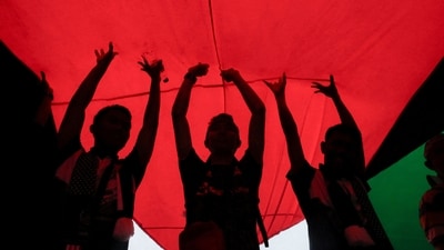Israel-Hamas War: Protesters hold a giant Palestinian flag during a protest. (Reuters)