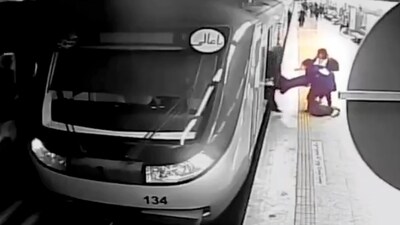 In this image from surveillance video aired by Iranian state television, women pull 16-year-old Armita Geravand from a train car on the Tehran Metro on October 1. (AP) In this image from surveillance video aired by Iranian state television, women pull 16-year-old Armita Geravand from a train car on the Tehran Metro on October 1. (AP)
