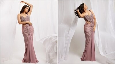 Sharvari wore the ensemble with minimal jewels, including statement rings and dainty ear studs. In the end, the actor chose darkened brows, shimmery pink eye shadow, smudged eyeliner, blushed cheeks, beaming highlighter, mascara on the lashes, glossy mauve lip shade, and centre-parted open locks with waves for the glam picks. (Instagram) Sharvari wore the ensemble with minimal jewels, including statement rings and dainty ear studs. In the end, the actor chose darkened brows, shimmery pink eye shadow, smudged eyeliner, blushed cheeks, beaming highlighter, mascara on the lashes, glossy mauve lip shade, and centre-parted open locks with waves for the glam picks. (Instagram)