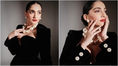 Sonam accessorised the ensemble with a statement-making cut-out black felt cage hat by Tamara Ralph. For jewels, she chose an OTT pearl choker necklace, statement rings, pearl-adorned earrings, and black stilettos with killer high heels. (Instagram) Sonam accessorised the ensemble with a statement-making cut-out black felt cage hat by Tamara Ralph. For jewels, she chose an OTT pearl choker necklace, statement rings, pearl-adorned earrings, and black stilettos with killer high heels. (Instagram)