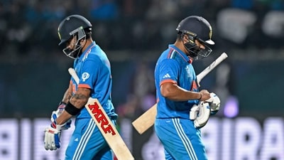 India's Virat Kohli arrives to bat as team's captain Rohit Sharma (R) walks back to the pavilion after his dismissal during the 2023 ICC Men's Cricket World Cup one-day international (ODI) match between India and New Zealand (AFP) India's Virat Kohli arrives to bat as team's captain Rohit Sharma (R) walks back to the pavilion after his dismissal during the 2023 ICC Men's Cricket World Cup one-day international (ODI) match between India and New Zealand (AFP)