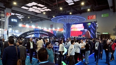 People visit the 7th edition of the India Mobile Congress, at Pragati Maidan in New Delhi on Friday. (ANI Photo) People visit the 7th edition of the India Mobile Congress, at Pragati Maidan in New Delhi on Friday. (ANI Photo)