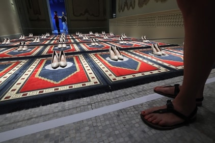 Visitors look at "Silence Rouge et Bleu" by French-Algerian artist Zoulikha Bouabdellah, at the Forbidden Art Museum in Barcelona on October 26, 2023. (Photo by LLUIS GENE / AFP)