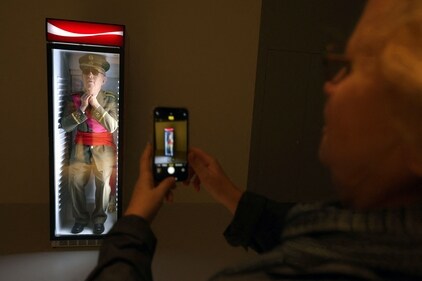 Visitors look at "Always Franco" by Spanish artist Eugenio Merino, at the Forbidden Art Museum in Barcelona on October 26, 2023. (Photo by LLUIS GENE / AFP)