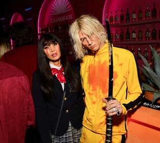 Megan Fox and Machine Gun Kelly dressed as characters from Kill Bill. Megan Fox and Machine Gun Kelly dressed as characters from Kill Bill.