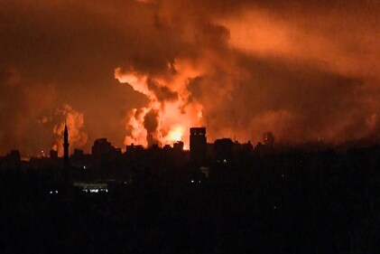 This image grab from an AFP TV footage shows balls of fire and smoke rising above Gaza City during an Israeli strike on October 27. (AFP) This image grab from an AFP TV footage shows balls of fire and smoke rising above Gaza City during an Israeli strike on October 27. (AFP)