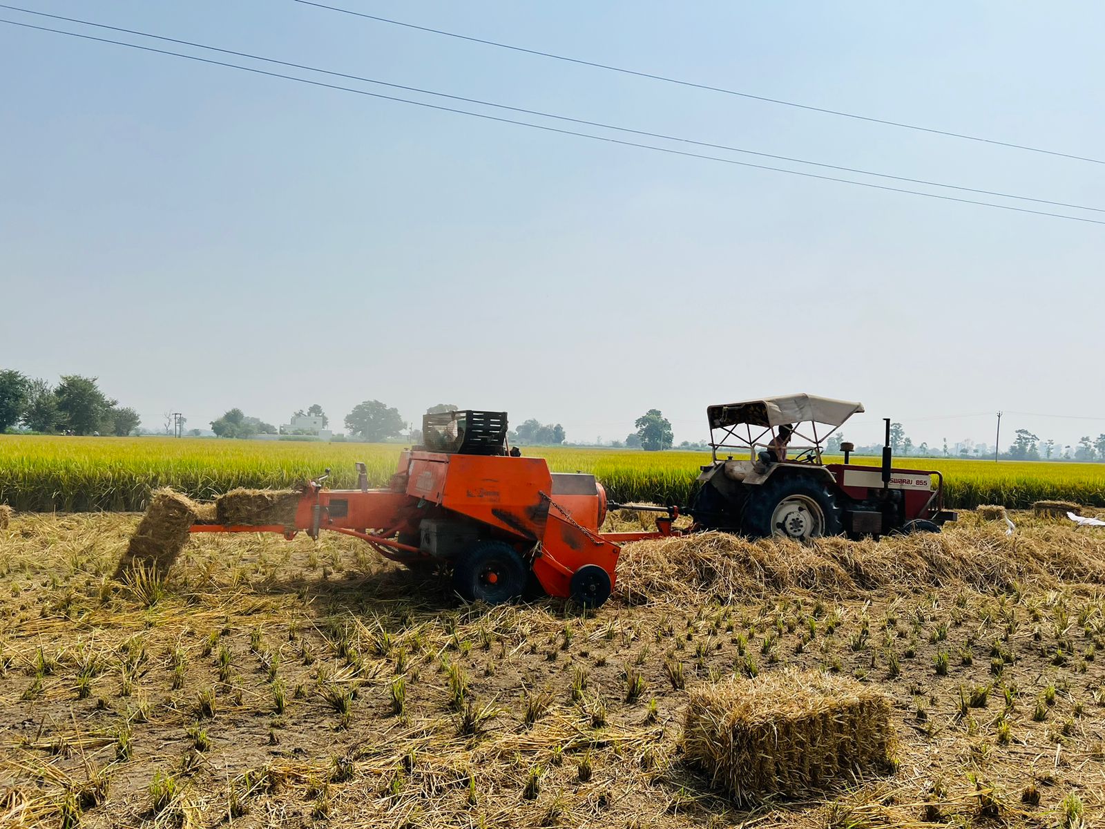Harvinder Singh (45), a resident of Balad Khurd, Paramveer Singh (35), a resident of village Deva Mander and Varinder Singh, a resident of Ludhiana district are collecting straw from farmers’ fields, making bales. (HT Photo) Harvinder Singh (45), a resident of Balad Khurd, Paramveer Singh (35), a resident of village Deva Mander and Varinder Singh, a resident of Ludhiana district are collecting straw from farmers’ fields, making bales. (HT Photo)