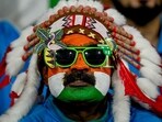An India fan watches the 2023 ICC Men's Cricket World Cup match between India and England at the Ekana Cricket Stadium in Lucknow