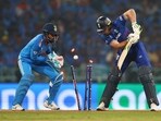 England's Jos Buttler is bowled out by India's Kuldeep Yadav 