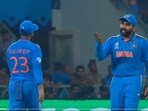 Rohit Sharma (L) talks to Kuldeep Yadav after a missed chance at reviewing the dismissal Rohit Sharma (L) talks to Kuldeep Yadav after a missed chance at reviewing the dismissal