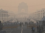 Commuters out on a smoggy morning amid rising air pollution at Kartavya Path in New Delhi on Saturday.