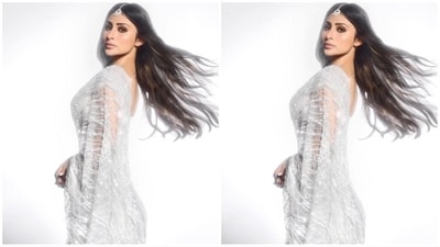 Assisted by hairstylist Queensly Chettiar, Mouni left her lush, long locks open at the centre, cascading beautifully down her shoulders and complementing her glam look. (Instagram/@imouniroy) Assisted by hairstylist Queensly Chettiar, Mouni left her lush, long locks open at the centre, cascading beautifully down her shoulders and complementing her glam look. (Instagram/@imouniroy)