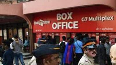 A crowd of people waiting in line to get movie tickets outside a cinema hall. (AFP)