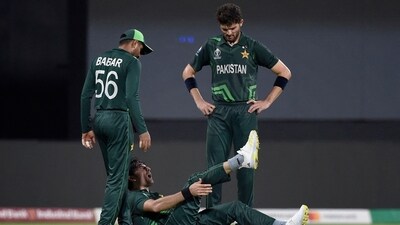 Pakistan's Mohammad Wasim Jr. reacts after sustaining an injury as Babar Azam and Shaheen Afridi watch (REUTERS)