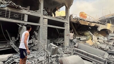 Israel-Hamas War: Palestinians search for casualties at the site of Israeli strikes on houses, in Gaza City. (Reuters)