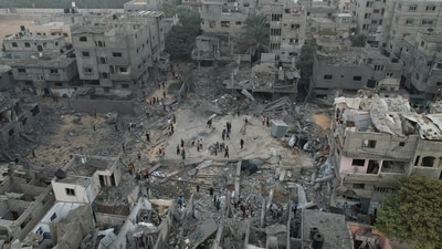Israel-Hamas War: A view of the remains of a mosque and houses destroyed by Israeli strikes in the central Gaza Strip. (Reuters)