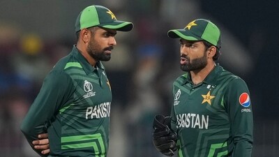 Pakistan's captain Babar Azam and wicketkeeper Mohammad Rizwan talk during the ICC Men's Cricket World Cup match between Pakistan and Afghanistan (AP) Pakistan's captain Babar Azam and wicketkeeper Mohammad Rizwan talk during the ICC Men's Cricket World Cup match between Pakistan and Afghanistan (AP)