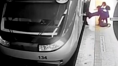 In this image from surveillance video aired by Iranian state television, women pull 16-year-old Armita Geravand from a train car on the Tehran Metro on October 1. (AP) In this image from surveillance video aired by Iranian state television, women pull 16-year-old Armita Geravand from a train car on the Tehran Metro on October 1. (AP)