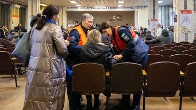 Medical staff provide assistance to a woman at the administration building of the Kostyenko coal mine in Karaganda. (AFP) Medical staff provide assistance to a woman at the administration building of the Kostyenko coal mine in Karaganda. (AFP)