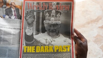 A Kenyan reads the Daily Nation newspaper with a portrait of Britain's King Charles III and the headline 'The Dark Past' in Nairobi. (AP) A Kenyan reads the Daily Nation newspaper with a portrait of Britain's King Charles III and the headline 'The Dark Past' in Nairobi. (AP)