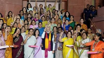 PM Modi flashes victory sign with women MPs after the passage of women’s reservation bill in the Rajya Sabha on Sept 21 (PTI Photo) PM Modi flashes victory sign with women MPs after the passage of women’s reservation bill in the Rajya Sabha on Sept 21 (PTI Photo)