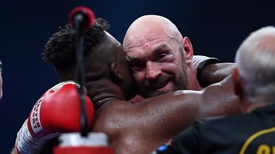 Tyson Fury, of England, the WBC and lineal heavyweight champion, facing, hugs former UFC heavyweight champion Francis Ngannou, of Cameroon, at their boxing match (AP) Tyson Fury, of England, the WBC and lineal heavyweight champion, facing, hugs former UFC heavyweight champion Francis Ngannou, of Cameroon, at their boxing match (AP)