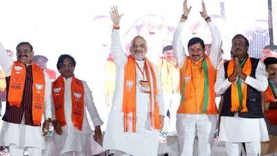 Union home minister Amit Shah acknowledges supporters at a rally in Ujjain on Sunday. Union home minister Amit Shah acknowledges supporters at a rally in Ujjain on Sunday.