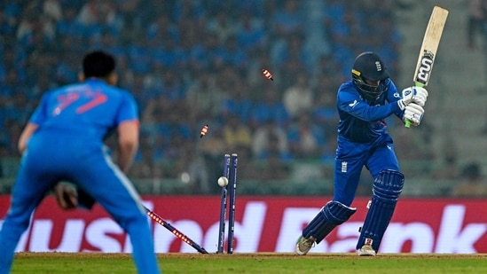 Adil Rashid (R) is clean bowled as Shubman Gill watches during the 2023 ICC Men's Cricket World Cup match between India and England(AFP)