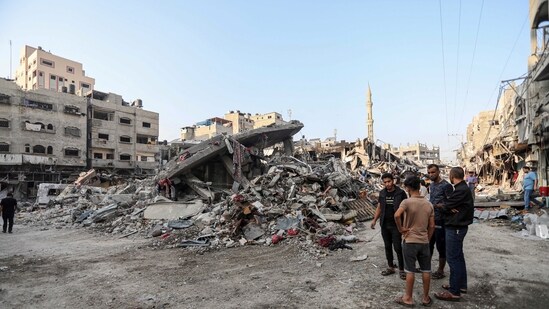 Palestinians inspect the damage of destroyed buildings caused by the ongoing Israeli airstrikes on Gaza City on October 28. Palestinians inspect the damage of destroyed buildings caused by the ongoing Israeli airstrikes on Gaza City on October 28.
